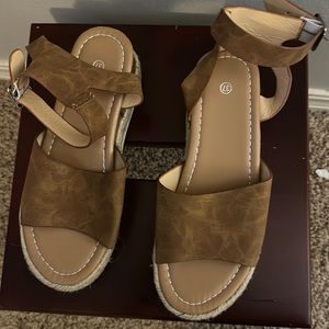 Brown sandals with ankle strap